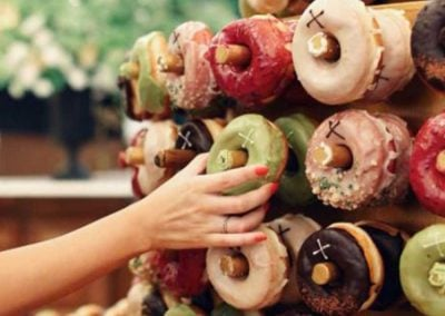 Wedding Doughnut Wall | Person Taking Doughnut