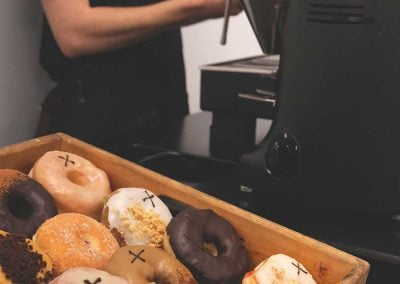 Coffee Cart Hire | Crosstown seasonal doughnuts on display at a coffee bar