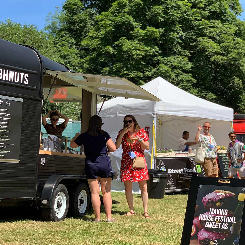 People enjoying Crosstown Doughnuts at a House Festival event